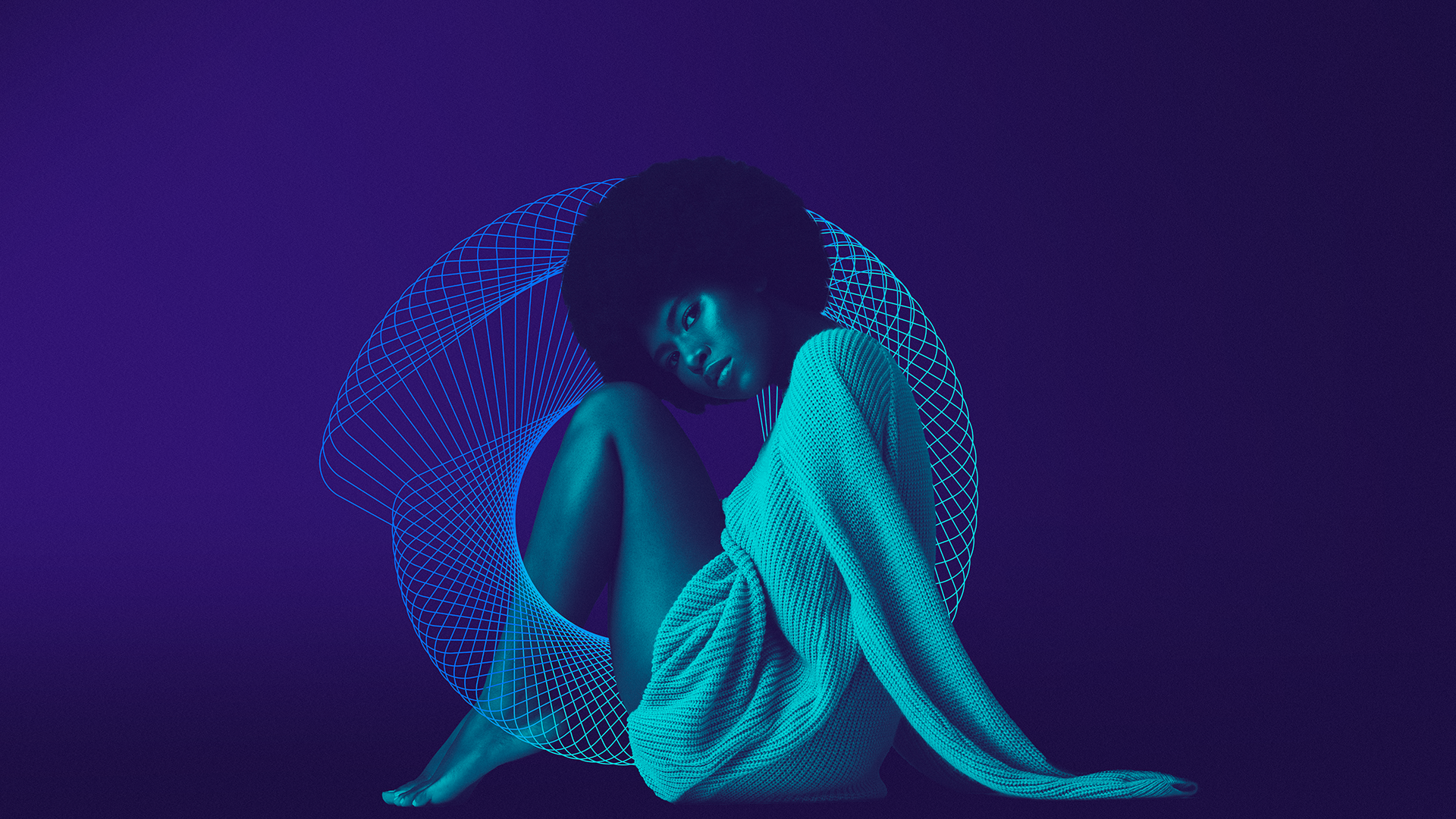 BloomLabs: model in a turquoise dress with a blue wireframe